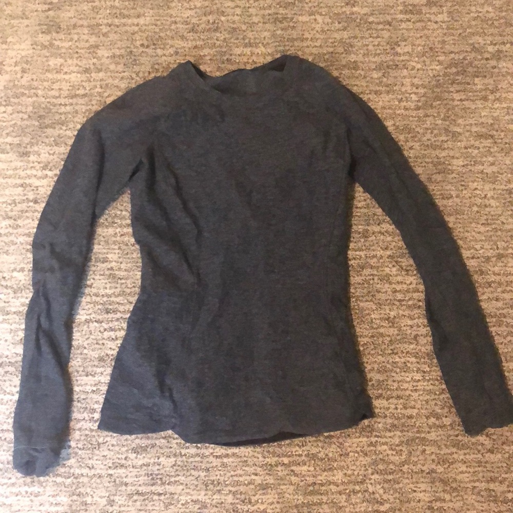 this is a size 4 dark blue long sleeve lulu shirt.